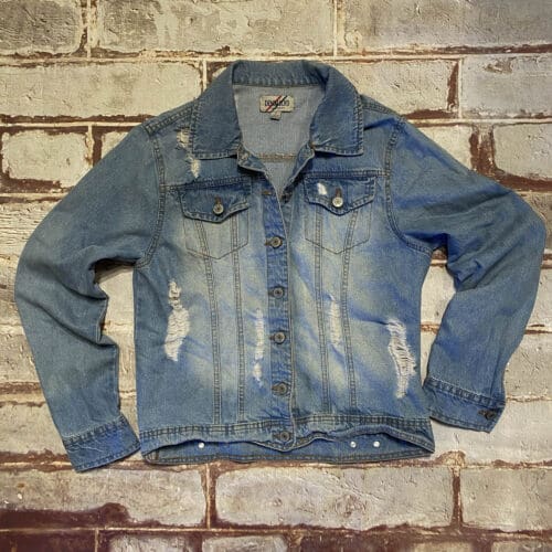 Blue denim jacket laid flat – classic secondhand fashion staple.